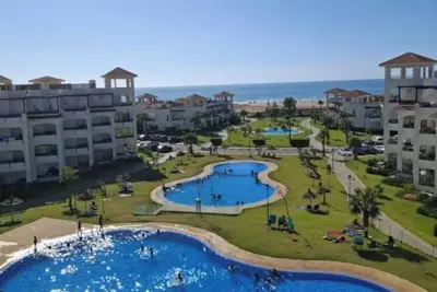 Image de Appartement Pieds dans l’eau, résidence sécurisée, 4 piscines, parking, wifi…