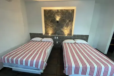 Image de Costa Ayala suite 8 with 2 dbl bed and 1 sofa, all basics, 2 blocks from beach