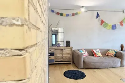 Image de Location: Prime location, just steps from the sea, the Rotonda a Mare, and the historic center. Description: Located on the first floor, this new three-room apartment is furnished in an industrial style. The interior spaces are enhanced by exposed brick w