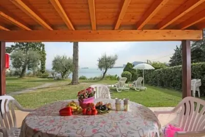 Image de Dreizimmerwohnung in Villaggio Sanghen by Interhome
