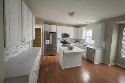 Image de 6br Executive Home. Gym, Office&Ev Charger Designed for Living, not Just Staying