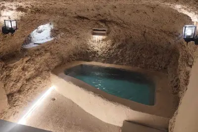 Image de Micaela Cave. Swimming pool in cave and sea views.