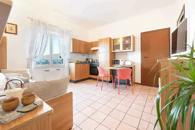 Image de Appartement de vacances avec balcon ou terrasse, plage privée et parking