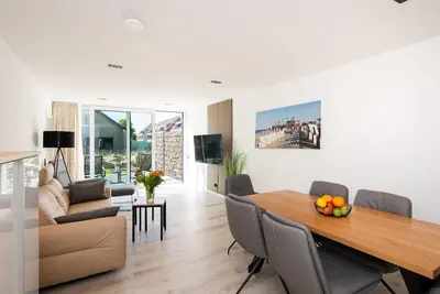 Image de Inseltörn apartment 2 - terrace, outdoor shower & entry to the swimming pool included.