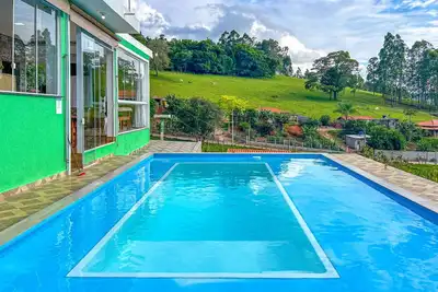 Image de Chácara com WiFi, piscina, churrasqueira e conforto