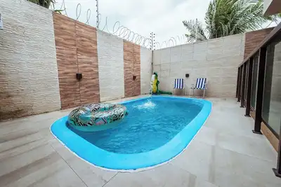 Image de Casa em Jacumã, com piscina, 5 suites e Fliperama