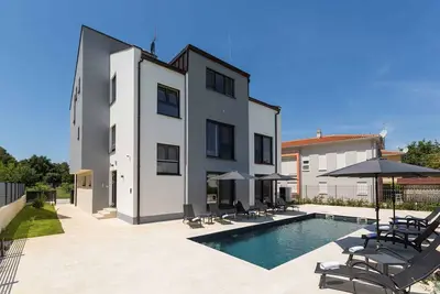 Image de Appartement de vacances avec climatisation et piscine à usage commun