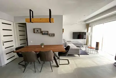 Image de Appartement de vacances avec piscine, jacuzzi et sauna près de l’eau