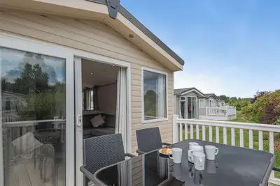 Image de Gold Caravan with parking & decking