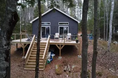 Private 3-bedroom waterfront house with dock and paddle boards.