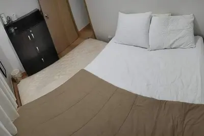 Image de Amazing 2-bedroom budget apartment with Ac and prepaid wi-fi in Trees Residences