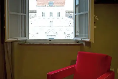 Image de Welcome to Casa della Colonna, a refined apartment where contemporary design meets the ancient history of Lucca. Located on the first floor with elevator access, this unique residence is built upon the ancient Roman walls dating back to 180 B. C. , near