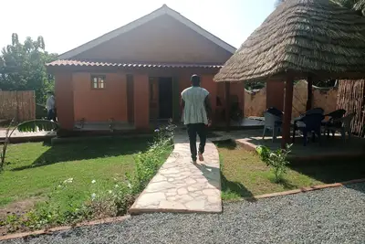 Image de Villa Colibri Cottage avec sa piscine situés à proximité de la cascade de Kpime