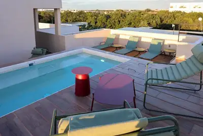 Image de Warm Terracotta 2br | Rooftop Sunsets in Aldea Zama