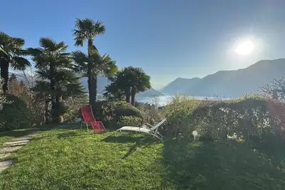 Villa with lake view and palm trees