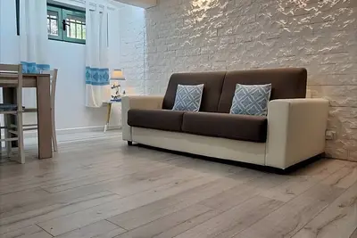 Image de Appartement 'La Sorrera De Mar Casa Vacanze' avec jardin commun et climatisation