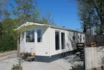 Image de Spacious 6-person chalet with large terrace in peaceful Oudesluis, close to beach, sea and wide open countryside.