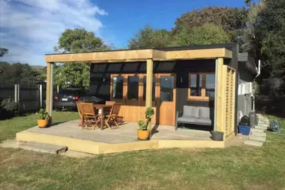 Image de Cosy 2bedroom kiwiana bach on the edge of the estuary