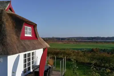 Image de Krügers Auszeit Zinnowitz – Maison de vacances confortable au bord de l'Achterwasser