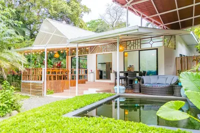 Image de Discover a rare architectural gem where the rainforest meets refined living