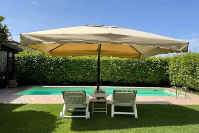Image de Maison de vacances 'Il Giardino Di Magò' avec piscine privée, jardin privé et Wi-Fi