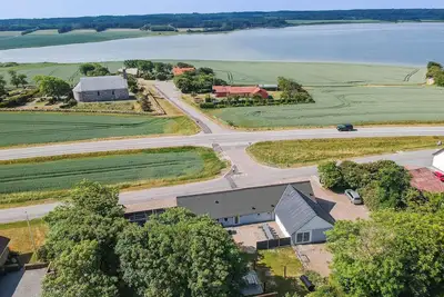 Image de 16-person holiday home with view over the water and wilderness bath.