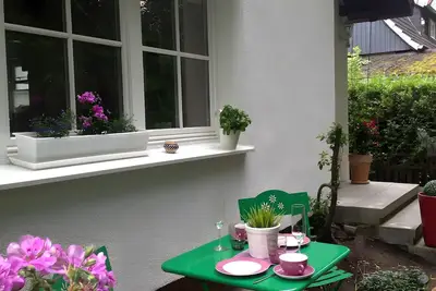 Image de Appartement « Pour 4 personnes 40 m² » avec terrasse privée, jardin commun et Wi-Fi