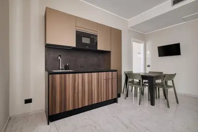 Image de Luxury Design Pantano is an elegant apartment in the heart of Milan, just steps from the Duomo. Furnished in a modern style, it offers a living room with a sofa bed, a room with an office area and refined rooms. Equipped with an equipped kitchen and all t