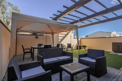 Image de GuestHost - A bright and welcoming 68 square meters apartment, perfect for four people, with a private entrance on the ground floor. The property is located in a quiet area of ​​Olbia and is close to all the main amenities, including restaurants, bars