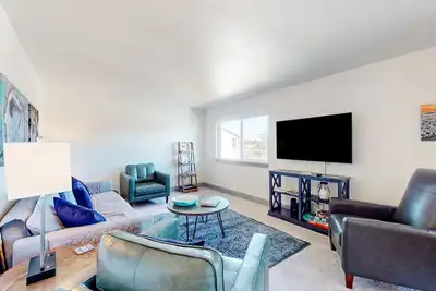 Updated condo with river view, convenient location, & private balcony