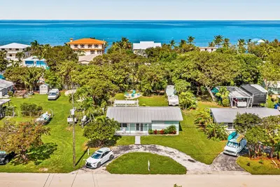 Image de Inviting home near the water with gazebo, fire table, and heated spa