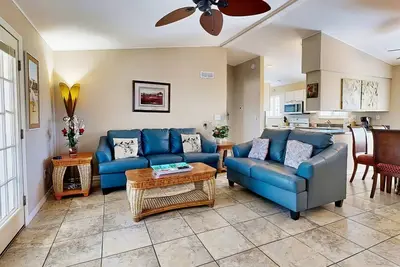 Canal front home w/ a dock, private pool, spacious deck, & easy water access