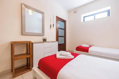 Image de budget apartment, affordable stay, cozy apartment, family friendly, group accommodation, patio apartment, outdoor space, free wifi, smart Tv, kitchen, central location, value stay, comfortable stay