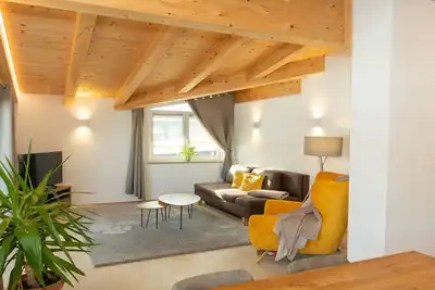 Image de Experience beautiful high-ceilinged living rooms with exposed roof trusses!