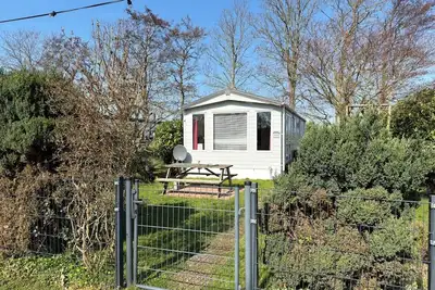 Image de Beautiful chalet with private parking space and quietly situated on the edge of our park.