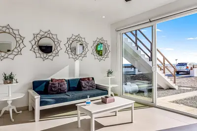 Dog-friendly oceanfront villa with rooftop patio, pool access, & kitchen