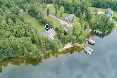 Image de Lakefront home with private beach, dock, deck, kayaks, game room, & fireplace