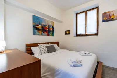 Image de SoleLago - Dormelletto, Garden, Patio, Barbecue, Sleeps 5, WiFi, Ac