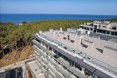 Image de Vacation apartment right on the beach. Sea view from the terrace of the building. Garage