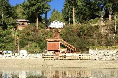 Image de Amazing Sunrise at Coastal Luxury Cabin Rental on Herron Island with Fire Pit and Paddle Boarding near Olympia, Washington