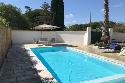 Image de Maison de vacances « La Perla » avec piscine partagée, Wi-Fi et climatisation
