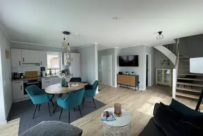 Image de Modern vacation home just 100 m from the Wangermeer with two bedrooms, smart TVs, fiber optics and terrace - perfect for families and those seeking relaxation.