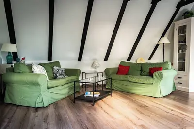 Image de The Zugvogel vacation home offers a cozy upper floor apartment in a quiet, secluded location near the North Sea - ideal for families and dog owners looking to relax in the fenced garden and natural surroundings.