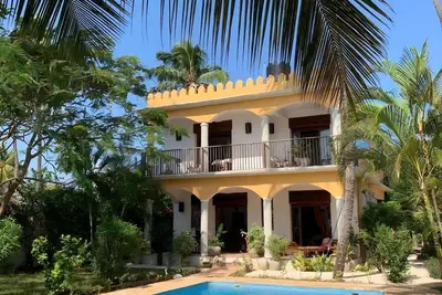 Private beachfront villa with pool