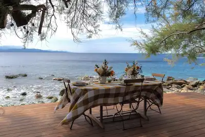 Image de A Casa Di U Scogliu. Maison en pierre les pieds dans l’eau. Cap Corse