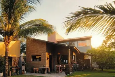 Image de Beach house: \"feet in the sand\" 1 minute from the freshwater pipes on the beachfront.