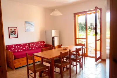 Image de A comfortable 65 square meters apartment, perfect for six people, located on the first floor of a building without an elevator within a residential complex. The property is located in Alghero and enjoys an excellent location, close to the sea and several