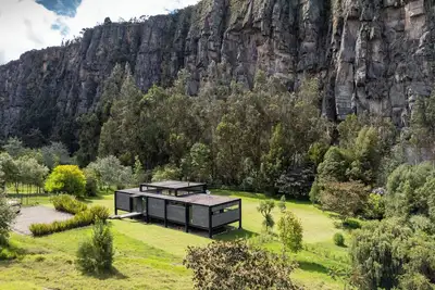 Image de Luxury house in the mountains surrounded by nature and rock cliffs.