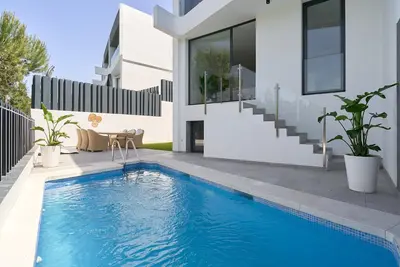 Image de The Caletas Village Luxury avec vue sur la mer et le golf de Baviera