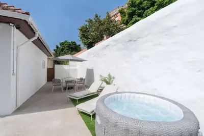 Relaxed Patio & Jacuzzi Flat by HostWise